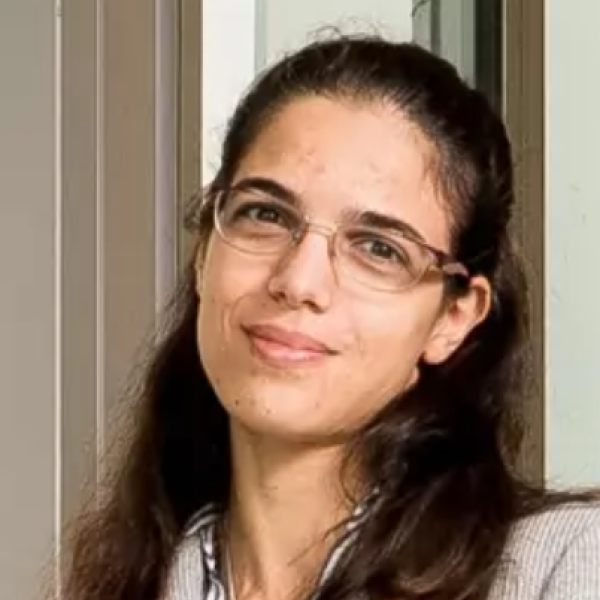 Female with long brown hair and glasses