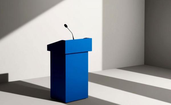 Blue Podium With Microphone in Empty Room