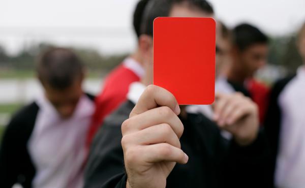A referee showing a red card