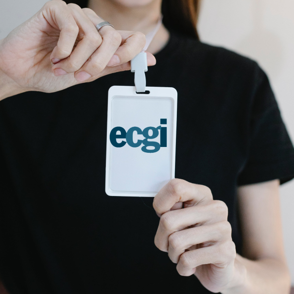 girl holding an ID badge