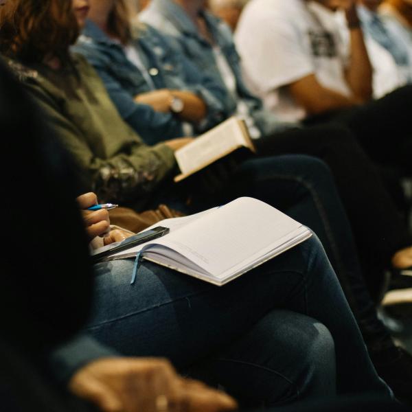 a row of people in an audience