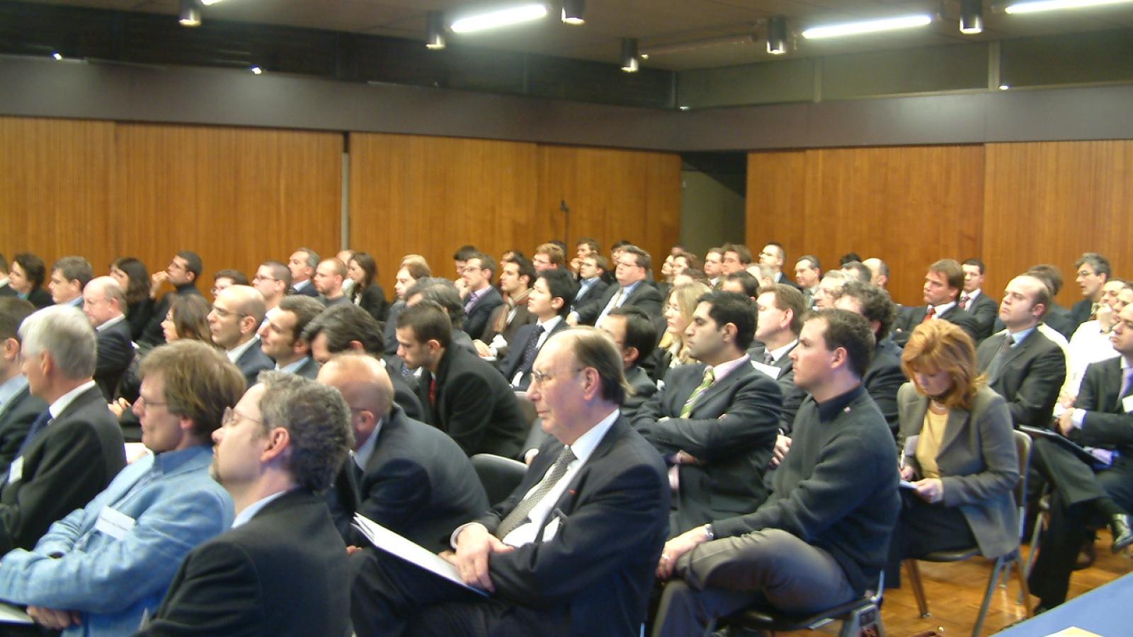 Men sitting in an auditorium