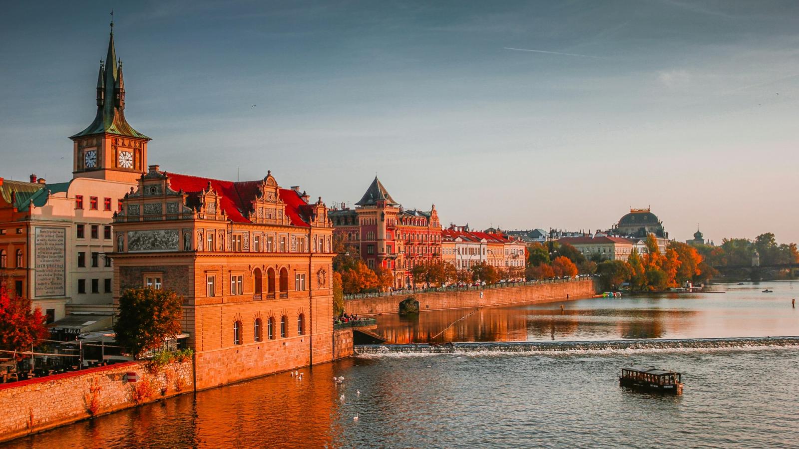 image of river and old buildings in prague
