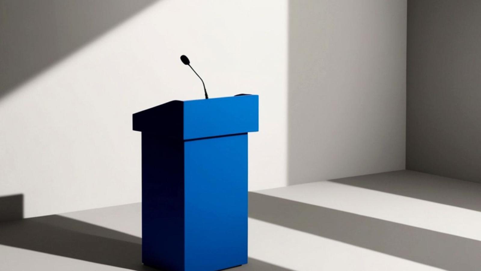 Blue Podium With Microphone in Empty Room