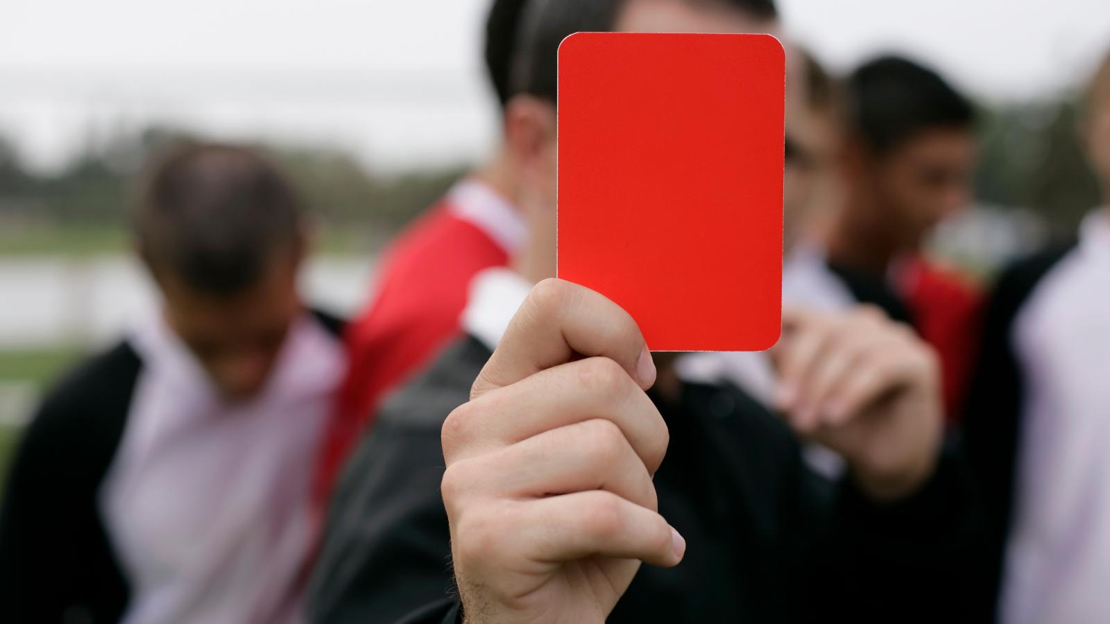 A referee showing a red card